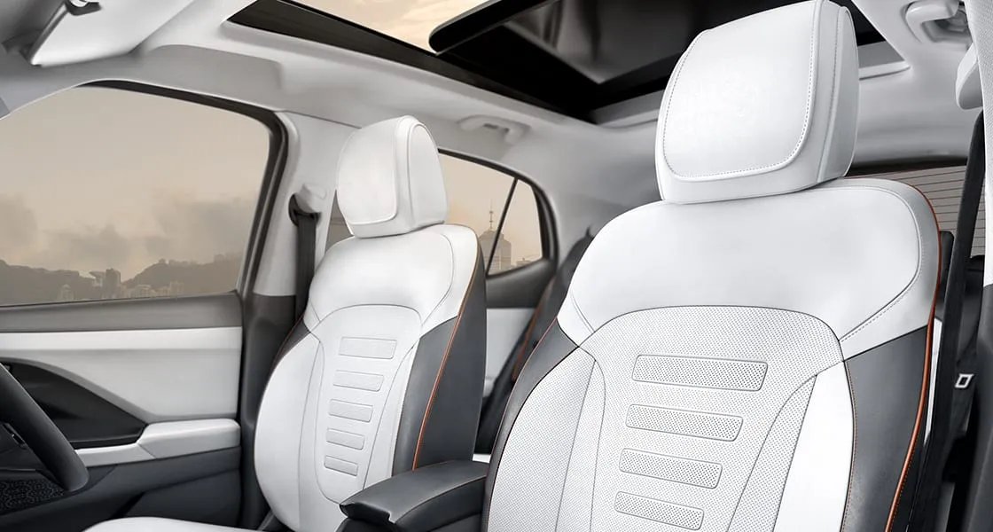Hyundai Creta front seats in light grey with dark piping, panoramic sunroof above